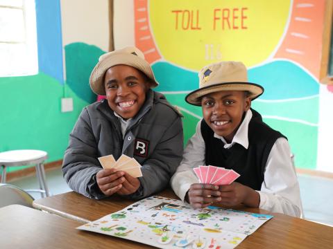 Children playing and learning with colorful toys in the Child Friendly Space at Potomane Primary School, showing joy, creativity, and engagement.