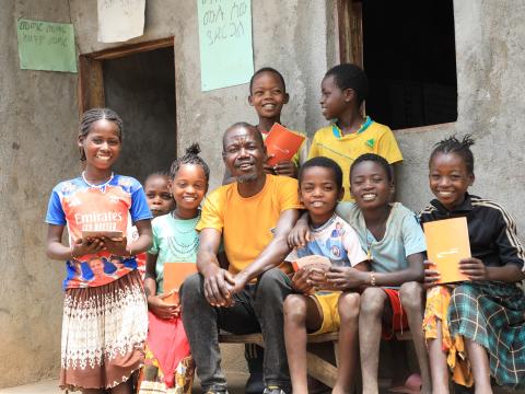 Kifle and with children smiling