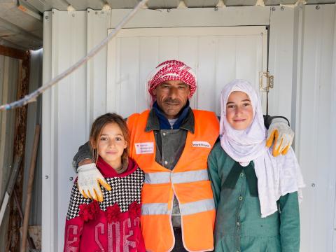 Ismail*, an Incentive Based Volunteer with his two daughters.