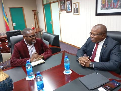 World Vision Eswatini National Director Amos Zaindi discussing with Commerce Minister Hon. Manqoba Khumalo 