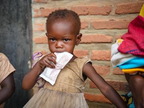 Mali, 1 year old eating the RUTF she received