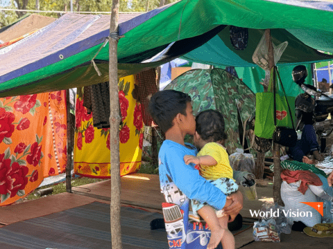 Leng is taking care of his 10-month-old younger sister while they are at the displacement site.
