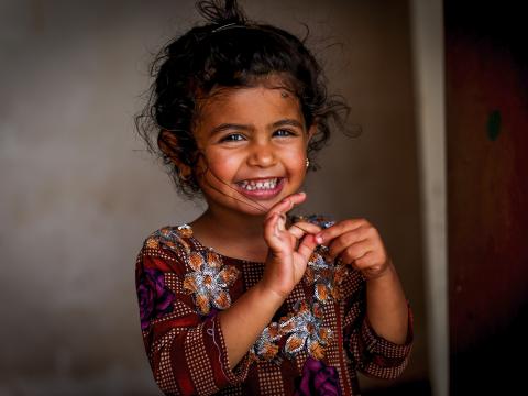 Portrait of a young Iraqi girl smiling