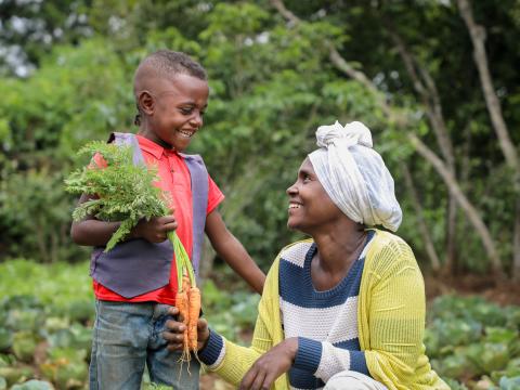 Kifle's family enjoys spending time together in their garden, a vegetable-filled yard.
