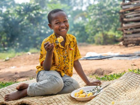 Javira, enjoys a nutritious meal. Uganda/2026