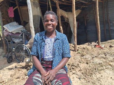 Constância next to her house destroyed by the floods.