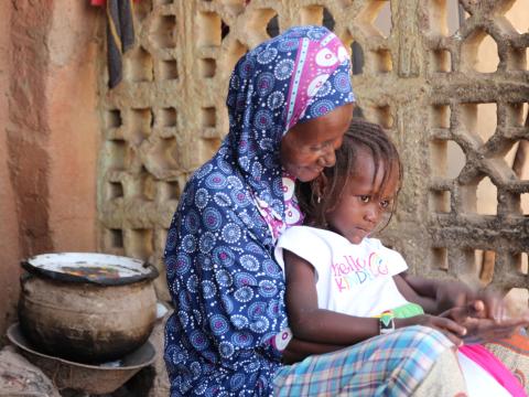 Every day, as soon as the dawn barely breaks, Nana gets up. Her body is tired, but her will is a fortress. She goes to the health center in her neighborhood of Dabani in San, not as a patient, but as a cleaner. The 15,000 FCFA= 26.82 Dollar US she earns each month is a meager consolation, a drop in the ocean of her needs. Once a trader, her husband's illness ruined her small business. Today, this stipend is her only treasure.