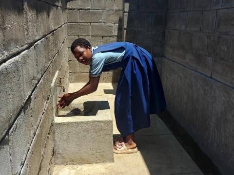 Vannesa accessing sanitary facility at her school