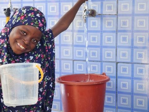 A child from Sae Saboua at a water point