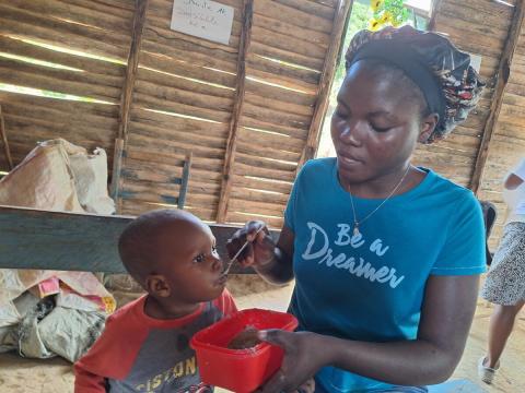 Mother feeding her child