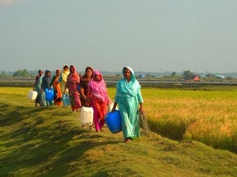Women collecting drinking water in a rural village in Bangladesh.