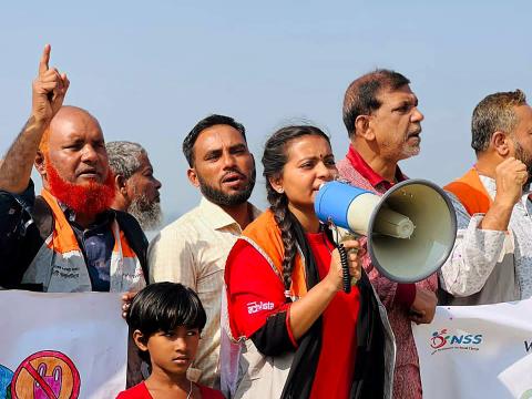Mukta, a World Vision Bangladesh youth leader,  leading a climate advocacy and disaster risk reduction rally with community members in Amtali, Barishal.