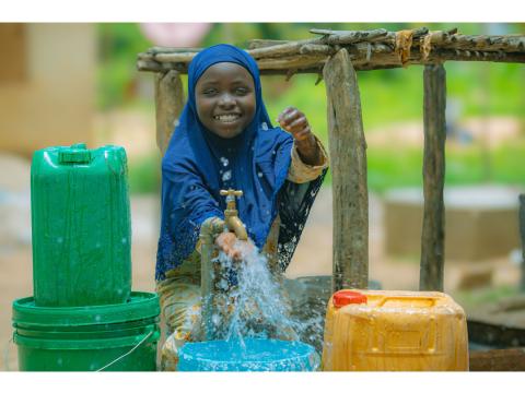 A child enjoying water.