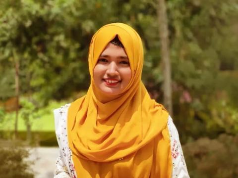 Taslima, an urban youth advocate in Chittagong smiling. 