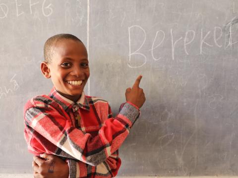 Bereket wrote his name on the blackboard