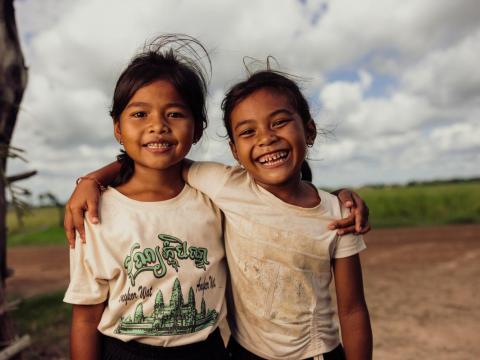 Two girls from Cambodia hugging