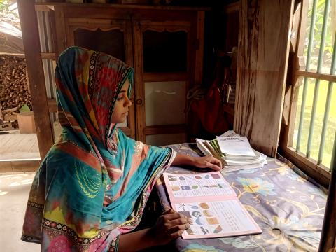 A young Bangladeshi girl, Aklima, focusing on her education after leaving child labor with the support of World Vision Bangladesh.