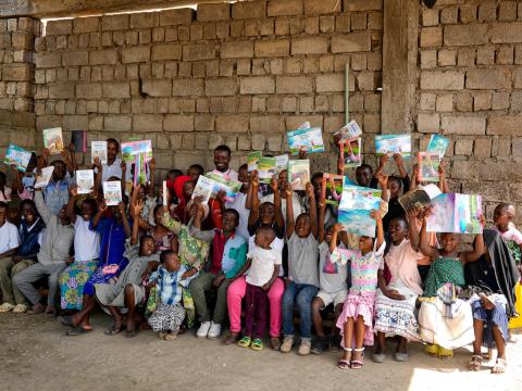 Bible reading club members showing their bibles