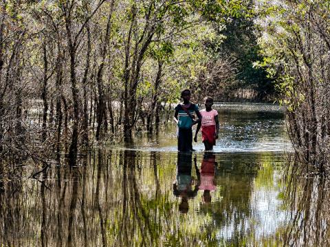 Children Still Walking Through Water