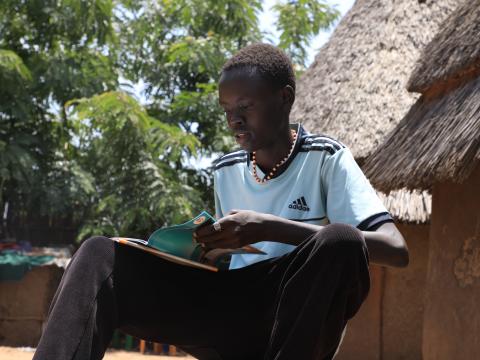 Chankos reading his book at home