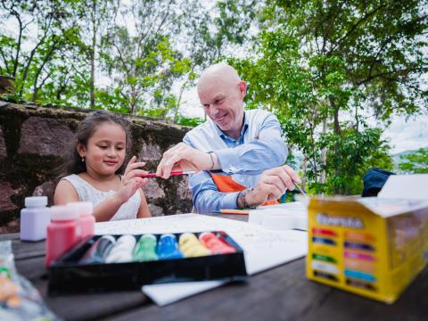 Andrew Morley drawing with a child