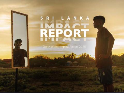 Young Sri Lankan boy looking at himself in mirror