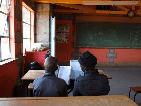 Tlotla and Sekonyela disccussing in their class
