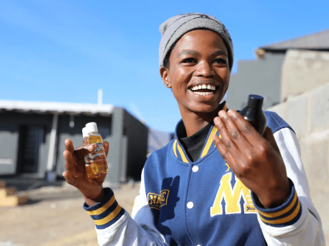 A young learns how to make products using rosehip