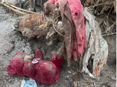 What remains of a toy of a child in aftermath of a disaster 