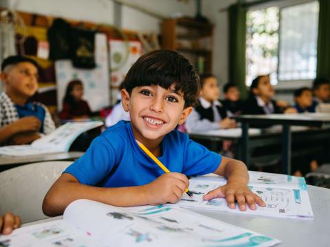 Palestinian boy in school in th West Bank