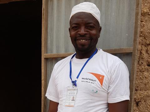 Moussa in front of his mini health post Moussa in front of his mini health post