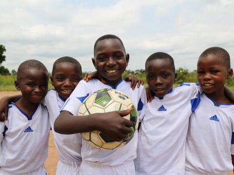 Boys play soccer at World Vision's Child Friendly Space in Kasai