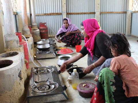 Ummah’s mother Rahima cooks meals in one of the 42 World Vision constructed community kitchens in seven camps where around 12-13 women can prepare food during one of two shifts, with up to 1,100 families using the kitchens daily.