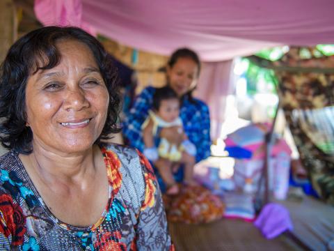 Huoy sitting in house with her family Huoy sitting in house with her family