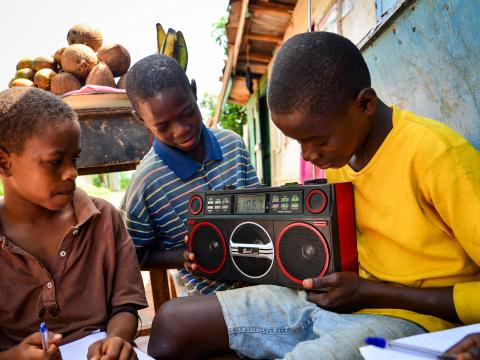 Children in Sierra Leone continue their education via radio, after the breakout of Ebola. Photo by Jonathan Bundu.