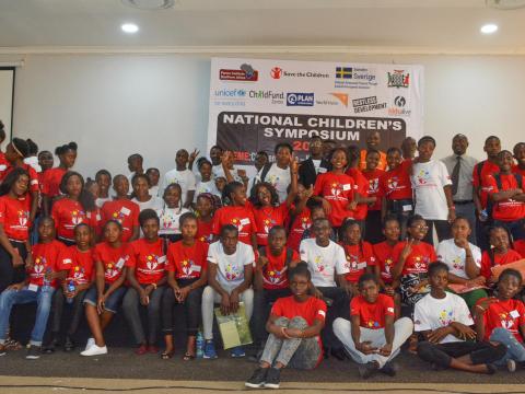 Children pose for a picture at the children symposium 