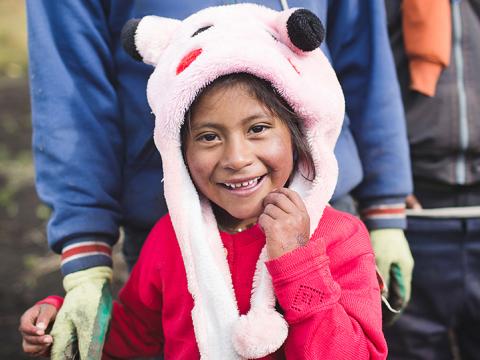 Soledad plays in her family's farm as business increases through microfinance Hope Through World Vision's Microfinance Work