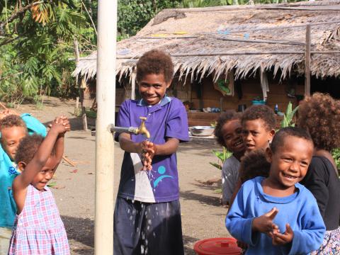 Jacinta and friends show how hand washing has become a part of school life.