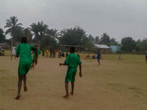 Albert* plays football with other children at World Vision's Child Friendly Space