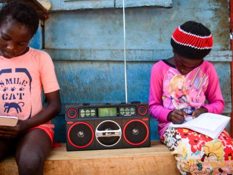 Listening to the teaching on the radio in Sierra Leone