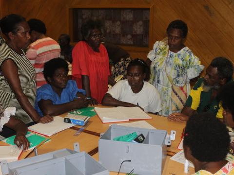 Community members participate in financial management training Community members participate in financial management training