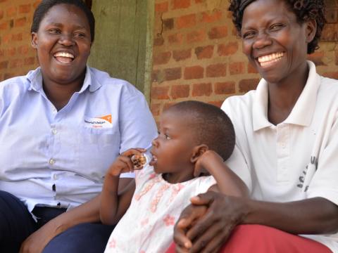 World Vision staff and mum laughing
