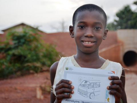 Hannah from Ghana proudly displays her favourite book Hannah from Ghana proudly displays her favourite book