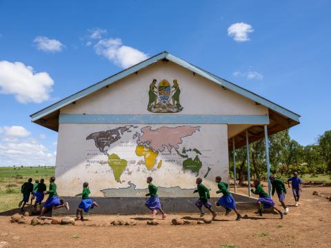 Children in Tanzania running around their school