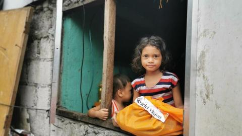 COVID-19 Emergency Response, girl with donations