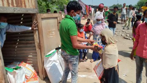 Distributing food to families in India