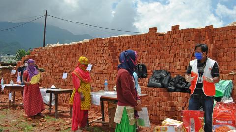 WVI Nepal staff facilitates food and hygiene kits distribution at a brick factory in Kathmandu on June 8, 2020. 