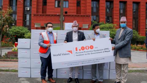 National Director Janes Ginting hands over 1,000 PPE and 120 Infrared (IR) thermometers to the Ministry of Health and Population (MoHP) on April 22, 2020.