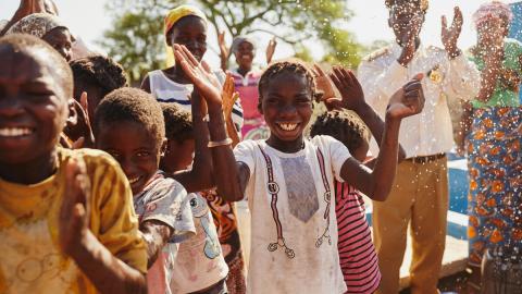 Children enjoying fresh water in Mozambique
