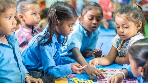 Children learning through Playing Materials
